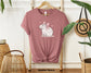 "Cute Capybara with Pink Bow Unisex Soft Cotton T-Shirt - Trendy 2024 Fashion Apparel"