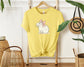 "Cute Capybara with Pink Bow Unisex Soft Cotton T-Shirt - Trendy 2024 Fashion Apparel"
